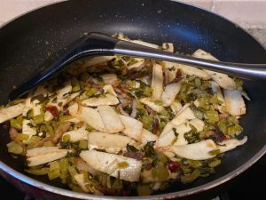 Incorporate the Snow Cabbage (1–2 minutes): Add the snow cabbage to the wok. Toss everything together until the greens are fragrant and well-distributed.