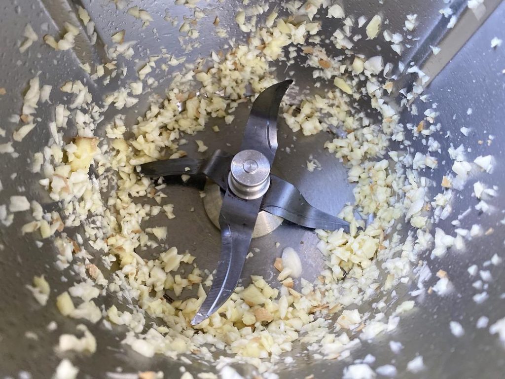 Prep the Tomatoes: Score an "X" on the bottom of each tomato. Blanch in boiling water for 60 seconds, then peel off the skin. Dice the tomatoes into small cubes. Mince your ginger and garlic.