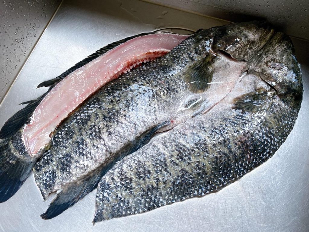 Fillet and Clean: Ask your fishmonger to fillet the fish and give you the bones, or do it yourself. Remove the ribs from the fillets and slice the meat at a 45-degree angle into 1/4-inch (6 mm) thick slices. Chop the fish bones into 2-inch chunks.