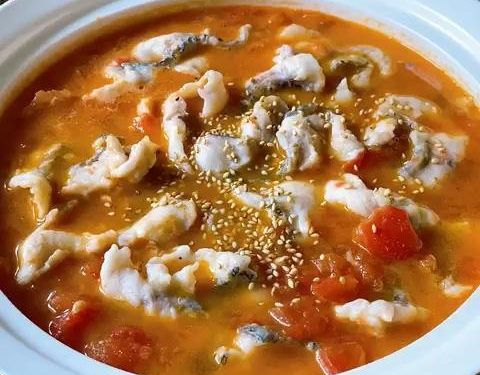 The Final Sizzle: Carefully transfer the fish and broth into your serving bowl over the bones. Top with scallions, sesame seeds, and Sichuan peppercorns. Heat 1 tbsp of oil in a small pan until smoking hot, then carefully pour it over the aromatics to release their essential oils.