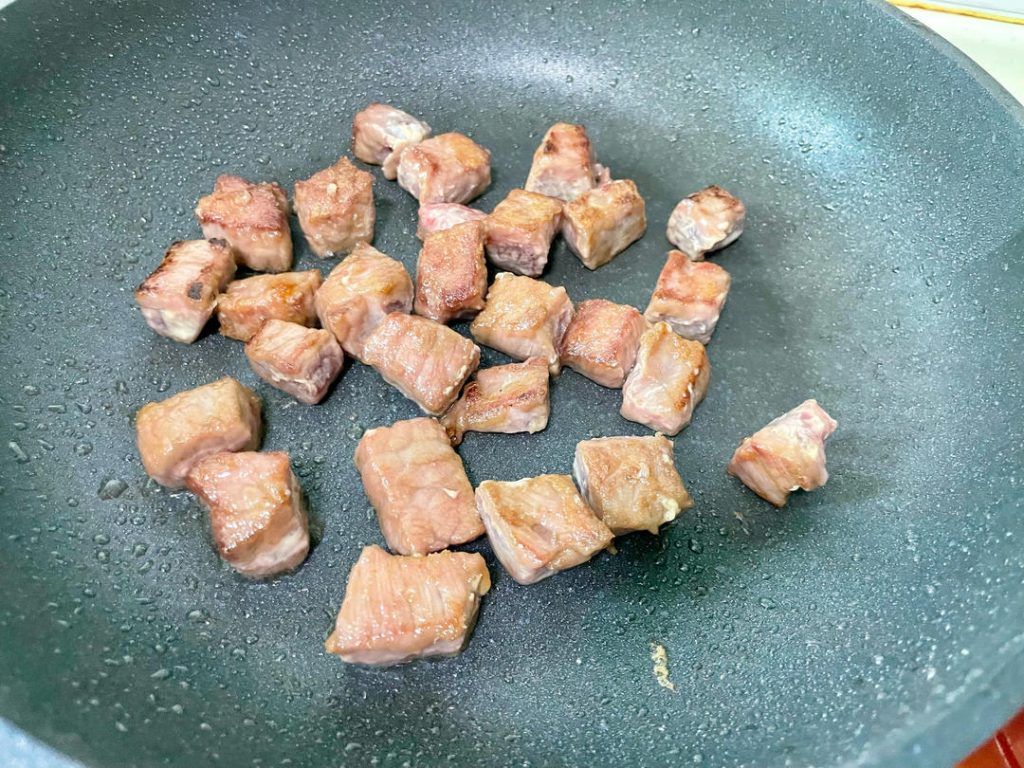 Cook the Beef: Immediately add the marinated beef cubes. Spread them into a single layer. Let them sear undisturbed for 30 seconds to develop a crust. Then, stir-fry swiftly for another 60 seconds until the exterior is browned but the inside is still slightly pink.