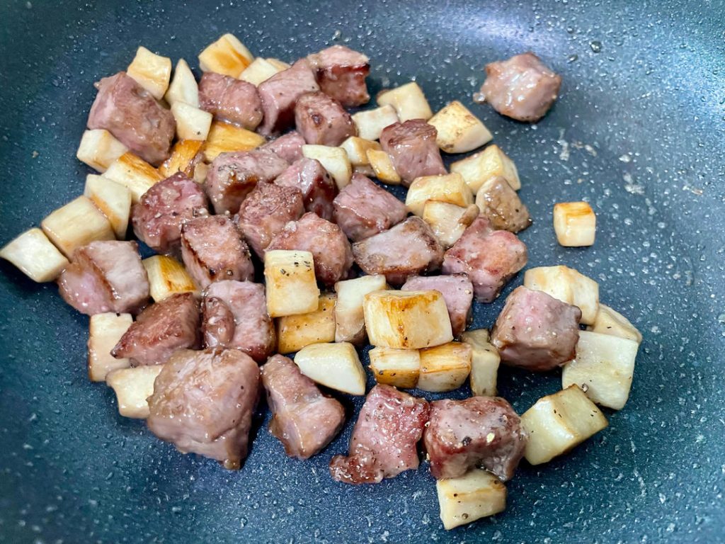 Combine and Season: Return the golden mushrooms to the pan. Toss everything together for 30 seconds.
