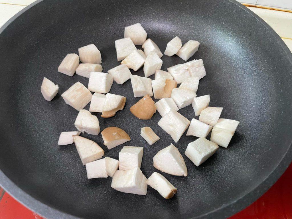 Sear the Mushrooms: Heat your wok or skillet over medium heat. Add 1 tablespoon of cooking oil. Add the cubed mushrooms and stir-fry until the surfaces turn golden brown, about 3 to 4 minutes. Remove and set aside. Why? This removes water and concentrates their earthy flavor.