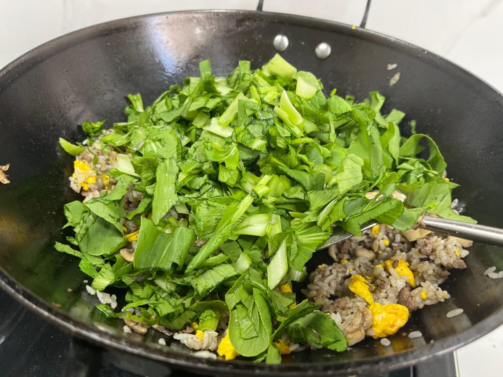 The Truffle and Greens Add the Black Truffle Sauce (about 2 tablespoons or to taste). Stir well to distribute the aroma. Finally, add the chopped greens.