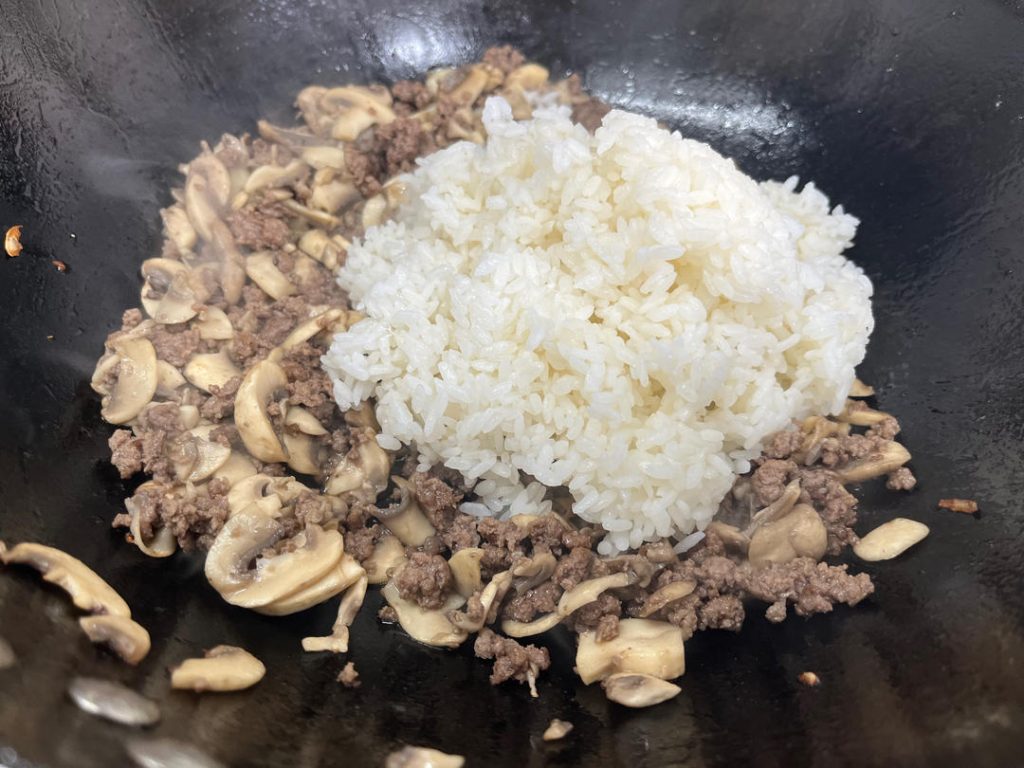 The Rice and The Return of the Egg Pour in the cold, day-old rice. Use your spatula to press down and break up any clumps, tossing it with the beef and mushrooms until the rice is hot and coated in that delicious beef tallow. Add the cooked eggs back in and toss to combine.