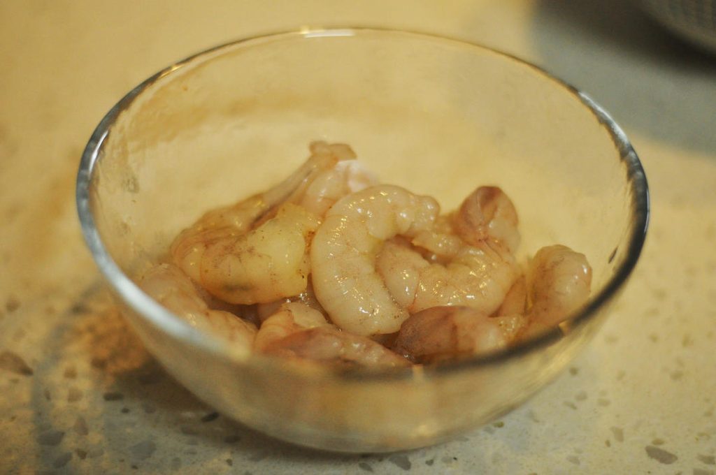Marinate Shrimp: Thaw shrimp if frozen. Pat dry. Mix with Shaoxing wine and white pepper. Let sit for 5 minutes.