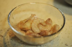 Marinate Shrimp: Thaw shrimp if frozen. Pat dry. Mix with Shaoxing wine and white pepper. Let sit for 5 minutes.