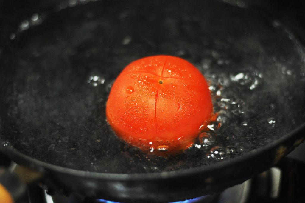 Blanch the Vegetables Bring a pot of water to a boil. Drop the tomato in for about 2 minutes until the skin starts to peel. Remove, run under cold water, peel off the skin, and dice the flesh. In the same boiling water, add the broccoli florets. Boil for 1-2 minutes until bright green but still crisp. Drain and set aside.
