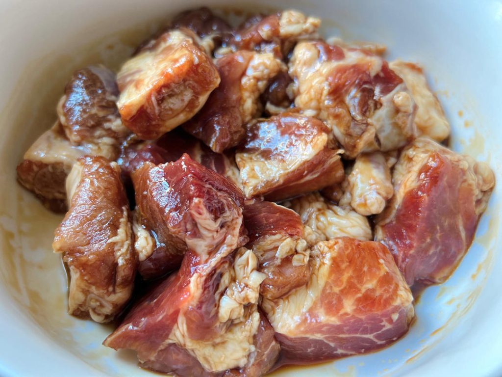 Marinate the Pork: In a bowl, toss the pork ribs with 1 tbsp light soy sauce, 1 tbsp oyster sauce, and the salt. Let it sit at room temperature for 30 minutes. This base seasoning is critical for flavorful meat.
