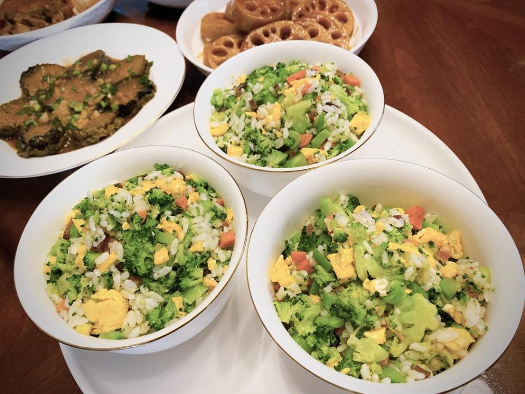 Add the chopped blanched broccoli and the scrambled eggs back into the wok. Sprinkle in the salt and drizzle the oyster sauce around the edges of the wok. Toss everything vigorously for about 1 minute until the seasonings evenly coat the rice and vegetables. Serve immediately.