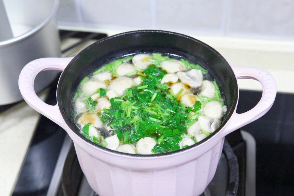 Season and Serve: Add the light soy sauce and salt. Stir to combine. Turn off the heat. Sprinkle with chopped cilantro and drizzle with sesame oil. Serve immediately while piping hot.