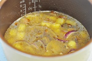 The Rice Cooker Method Place the washed, drained raw rice into your rice cooker pot. Add water.