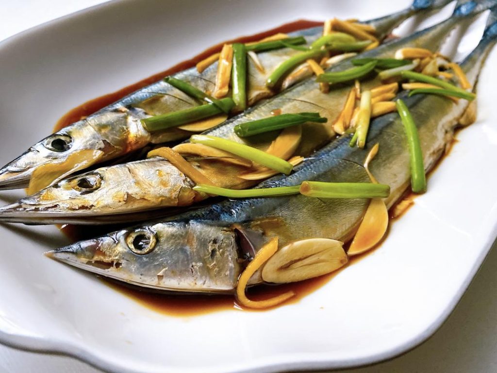 Marinate: In a bowl, combine the Shaoxing wine, light soy sauce, oyster sauce, black vinegar, salt, sugar, and white pepper. Massage this mixture over the fish, stuffing the ginger, garlic, and scallions into the belly. Let it marinate for 30 minutes, flipping occasionally.