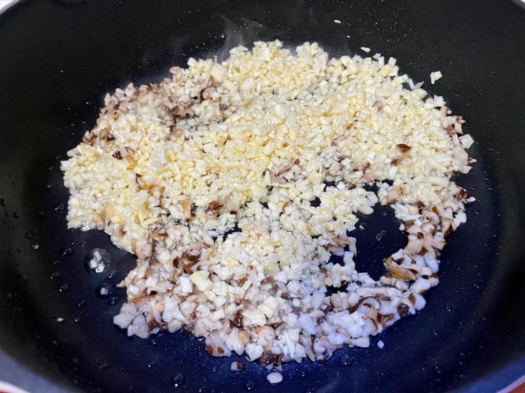 Mix the filling: In a large mixing bowl, combine the chopped greens, minced pork, and the cooled mushroom mixture. Add the egg, Shaoxing wine, salt, sugar, and seasoned oil.