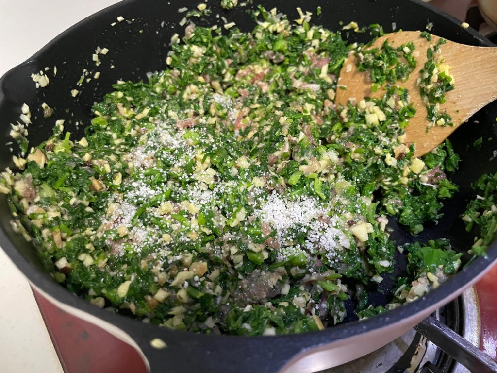 Mix the filling: In a large mixing bowl, combine the chopped greens, minced pork, and the cooled mushroom mixture. Add the egg, Shaoxing wine, salt, sugar, and seasoned oil.