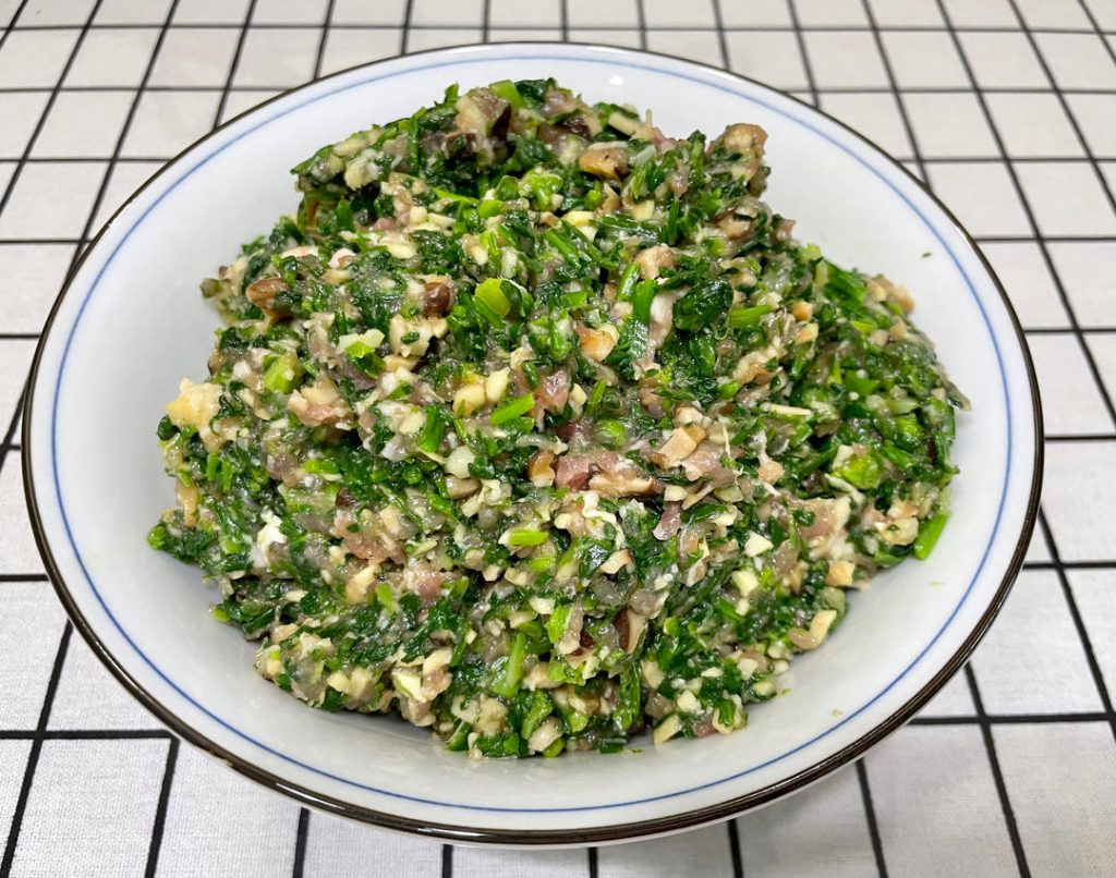 Stir vigorously: Use chopsticks to stir the mixture rapidly in one direction for 3 minutes until it becomes sticky. Why? This technique develops the myosin proteins in the meat, giving the filling a bouncy, cohesive texture.