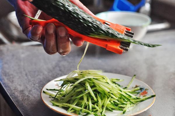 Prep Veggies: Wash the garlic scapes and chop them into small dice. Minced the ginger finely. Julienne the cucumber and set aside.