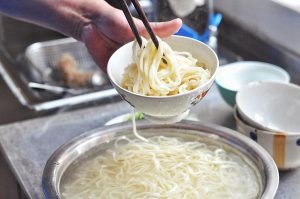 Bring a large pot of water to a boil. Add the noodles. When the water comes back to a boil, you can add a splash of cold water to settle it (a traditional method to ensure even cooking). Cook until the noodles are floating and have no white core (about 3-5 minutes depending on thickness).