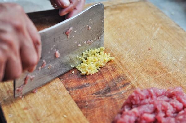 Prep Veggies: Wash the garlic scapes and chop them into small dice. Minced the ginger finely. Julienne the cucumber and set aside.
