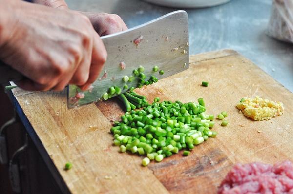 Prep Veggies: Wash the garlic scapes and chop them into small dice. Minced the ginger finely. Julienne the cucumber and set aside.