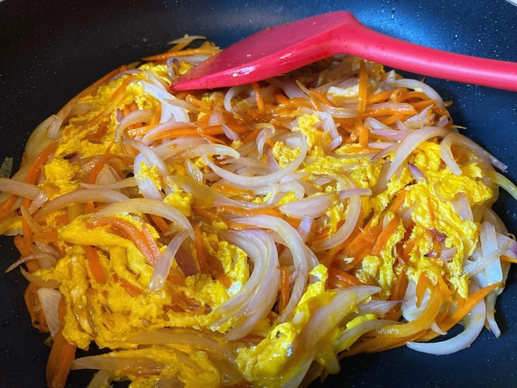 Flip and Scramble: Once the bottom of the eggs has set and formed a light crust, gently flip the mixture using a spatula. Break it apart into large chunks and stir-fry for another 30 seconds until the eggs are completely cooked and reach a safe internal temperature of 160°F (71°C).