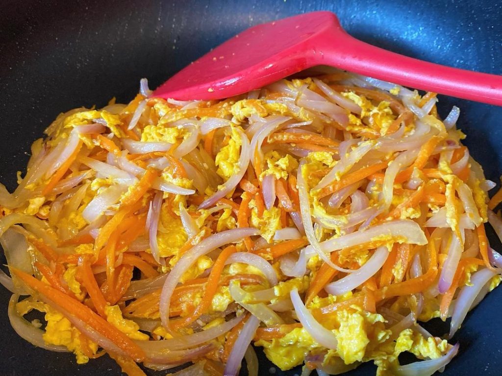 Flip and Scramble: Once the bottom of the eggs has set and formed a light crust, gently flip the mixture using a spatula. Break it apart into large chunks and stir-fry for another 30 seconds until the eggs are completely cooked and reach a safe internal temperature of 160°F (71°C).