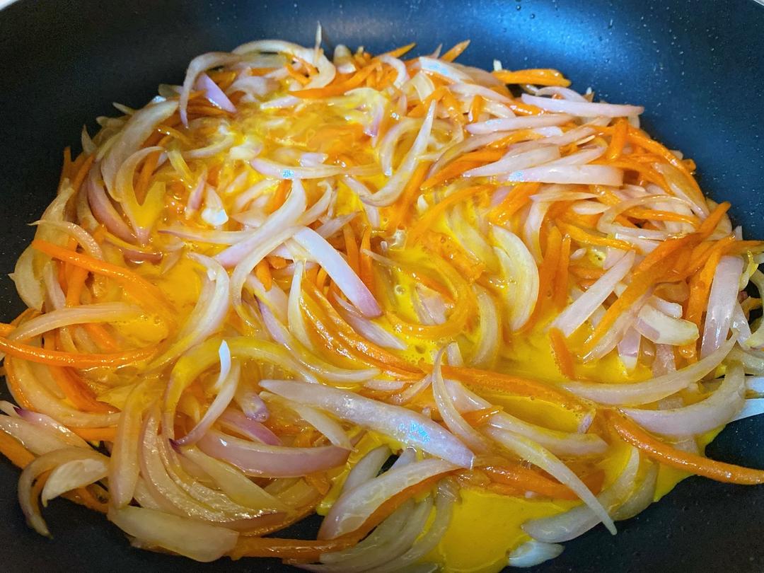 Pour in the Eggs: Pour the beaten eggs evenly over the vegetable mixture. Crucial step: Do not flip or stir immediately. Let the mixture sit undisturbed for about 15 to 20 seconds.