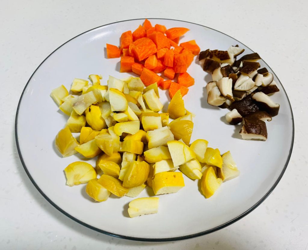 Meanwhile, prepare the chestnuts. If using fresh raw chestnuts, cut them in half. Bring a pot of lightly salted water to a boil. Boil the chestnuts for 2 minutes, then carefully peel off the hard shell and inner skin. Dice the peeled chestnuts.