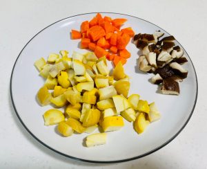 Meanwhile, prepare the chestnuts. If using fresh raw chestnuts, cut them in half. Bring a pot of lightly salted water to a boil. Boil the chestnuts for 2 minutes, then carefully peel off the hard shell and inner skin. Dice the peeled chestnuts.