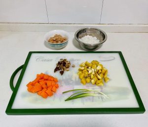 Finally, dice your carrots and shiitake mushrooms into pieces slightly smaller than the chestnuts.