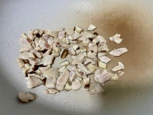 Sear the Chicken: Add the marinated chicken cubes. Spread them in a single layer and let them sear for 30 seconds. Stir-fry until the surface turns pale and opaque, about 2 minutes.