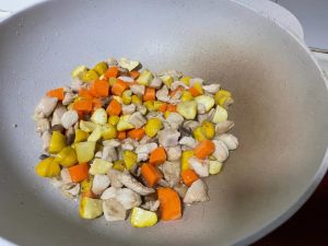 Add the Vegetables: Toss in the diced carrots and chestnuts. Stir-fry everything together for another minute to combine the flavors.