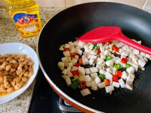 Combine: Toss the blanched mushrooms into the wok. Stir-fry for 1 minute so they heat up.