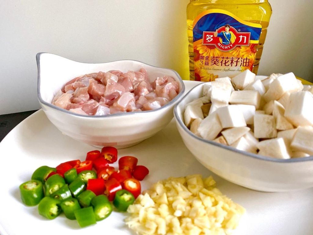 Stir-frying happens in minutes, so preparation is critical. First, dice your mushrooms and chicken into uniform 1/2-inch pieces. Uniformity ensures even cooking. Next, mince the garlic and slice the fresh green and red chilies.