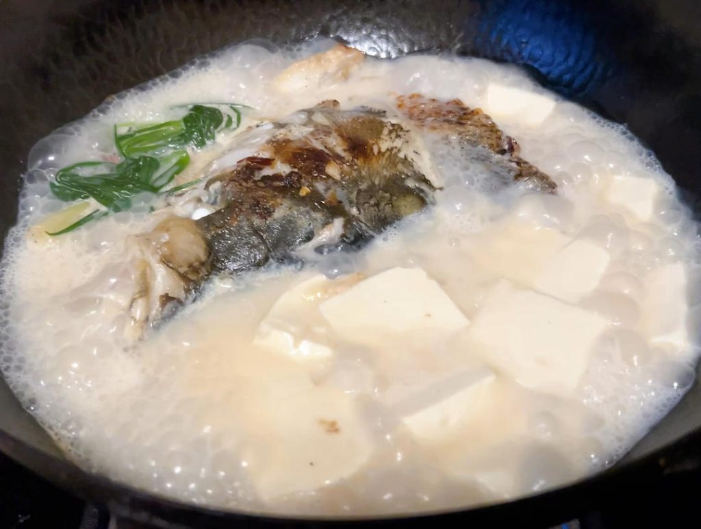 Add the Tofu
Gently slide the cubed soft tofu into the boiling broth. Reduce the heat to medium. Let the soup simmer steadily for another 3 to 5 minutes so the tofu can absorb the flavors of the broth.