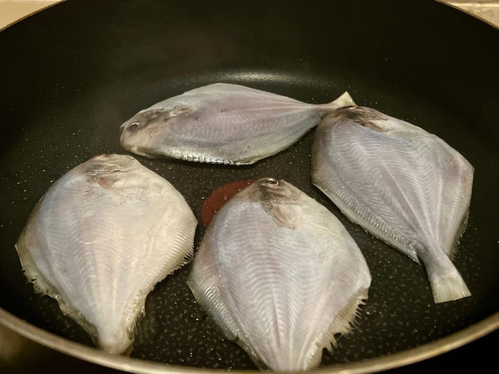 Sear the First Side: Once the oil is shimmering, gently lay the fish in the pan. Cook undisturbed until the bottom side turns a deep golden brown, about 3 to 4 minutes.