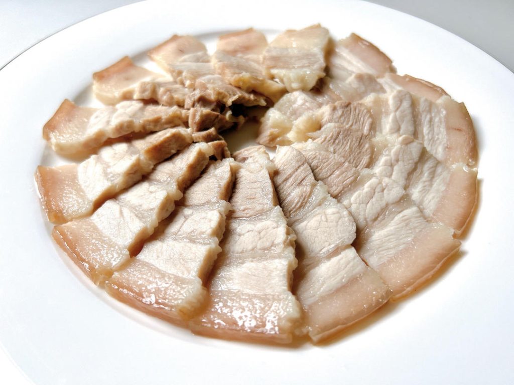 Chill and Slice: Let the pork rest on a cutting board for 10 minutes, or flash-chill in the freezer for 15 minutes. Use a sharp knife to slice the pork as thinly as possible.