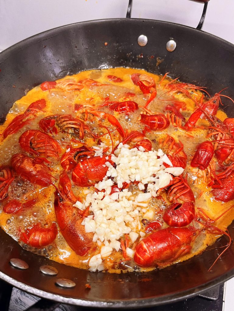 The Second Layer of Flavor Uncover and stir in the Oyster Sauce. At this point, add the remaining minced garlic, Sichuan peppercorns, and diced onion (if using). Stir well. Cover and simmer for another 5 minutes.