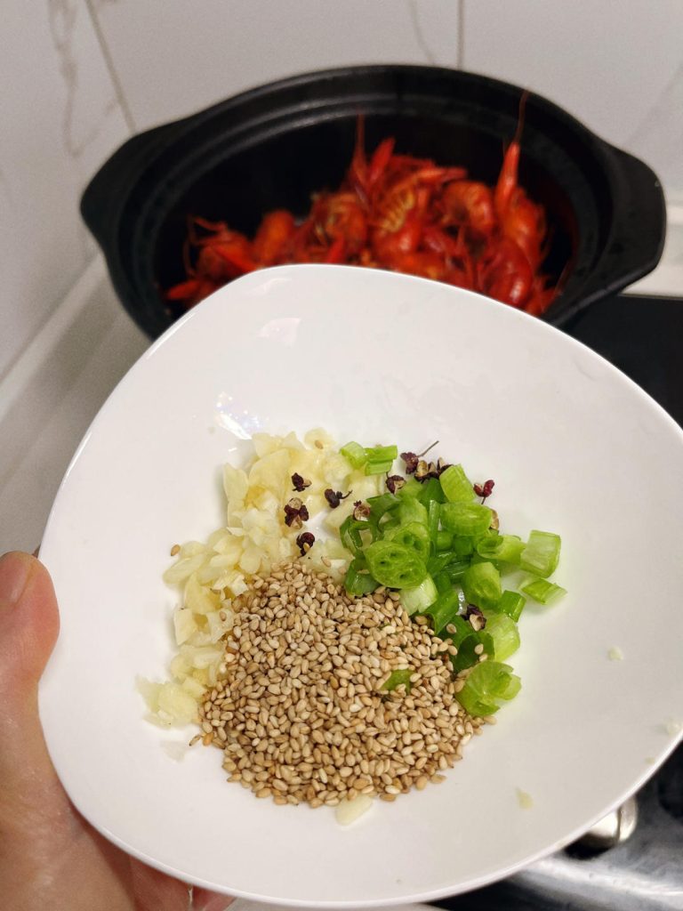 The Final Touch Once the sauce is thick and glossy, toss in the onion (if you haven't already) and cook for 2 minutes to release its sweetness. Turn off the heat. Sprinkle with chopped scallions, cilantro, and white sesame seeds.