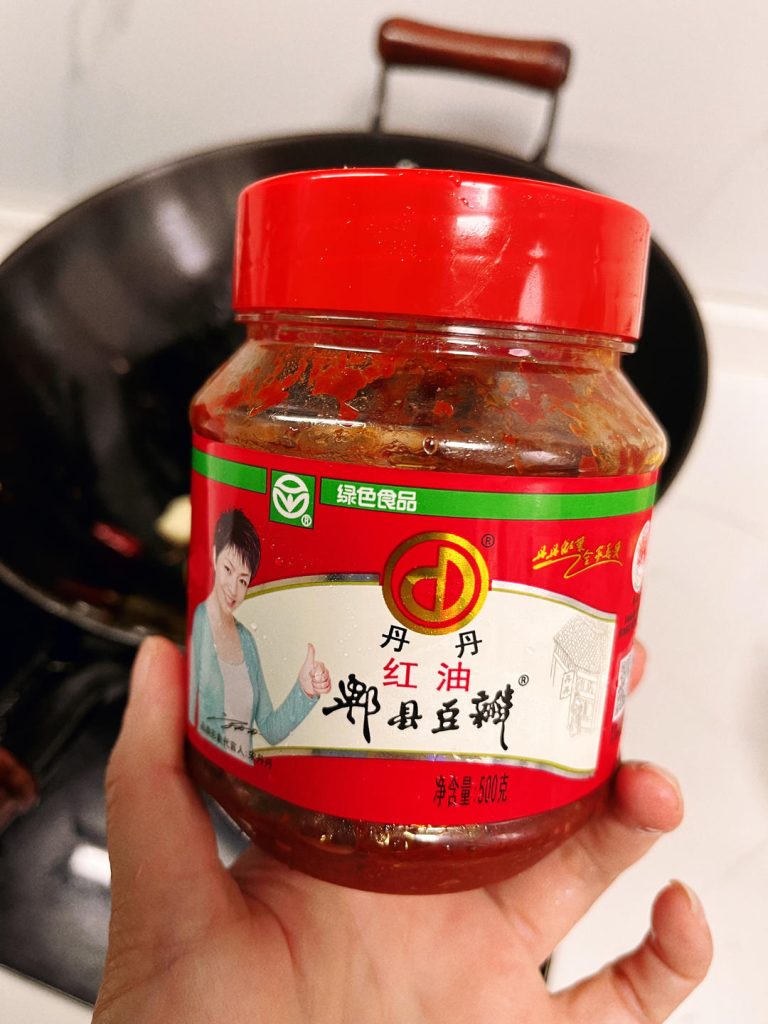 Braise the Crayfish Return the crayfish to the wok. Toss to coat in the aromatic oil. Add the Shaoxing wine, Light Soy Sauce, and sugar. Pour in the beer.