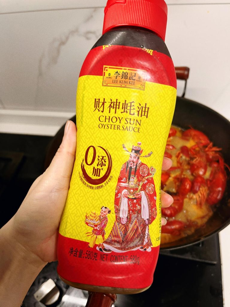 Braise the Crayfish Return the crayfish to the wok. Toss to coat in the aromatic oil. Add the Shaoxing wine, Light Soy Sauce, and sugar. Pour in the beer.