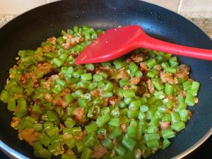 Combine and Season: Dump the chopped green beans into the wok. Toss vigorously for 30 seconds to combine with the pork. Add the remaining 1/2 tbsp of oyster sauce and 1/4 tsp of salt.