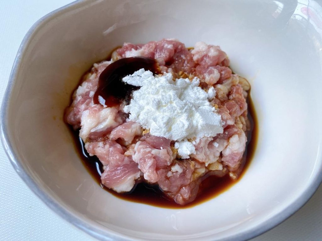 Marinate the Pork: In a small bowl, mix the ground pork with 1/2 tbsp oyster sauce, 1/2 tbsp light soy sauce, and cornstarch. Massage it with your fingers until sticky. Set aside.
