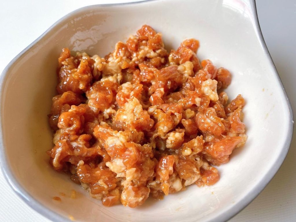 Marinate the Pork: In a small bowl, mix the ground pork with 1/2 tbsp oyster sauce, 1/2 tbsp light soy sauce, and cornstarch. Massage it with your fingers until sticky. Set aside.