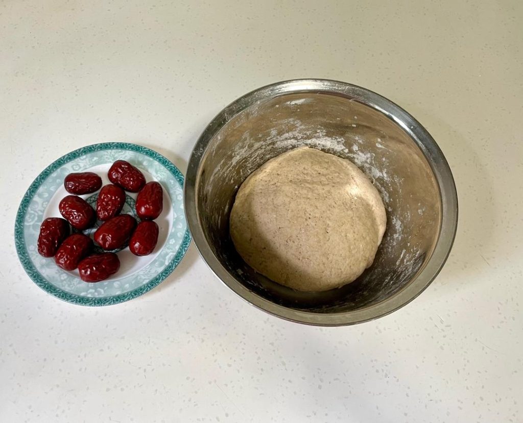 Degas & Add Mix-ins: Punch the dough down. Add the chopped red dates (and walnuts/raisins if using). Knead them into the dough thoroughly to push out excess air bubbles.