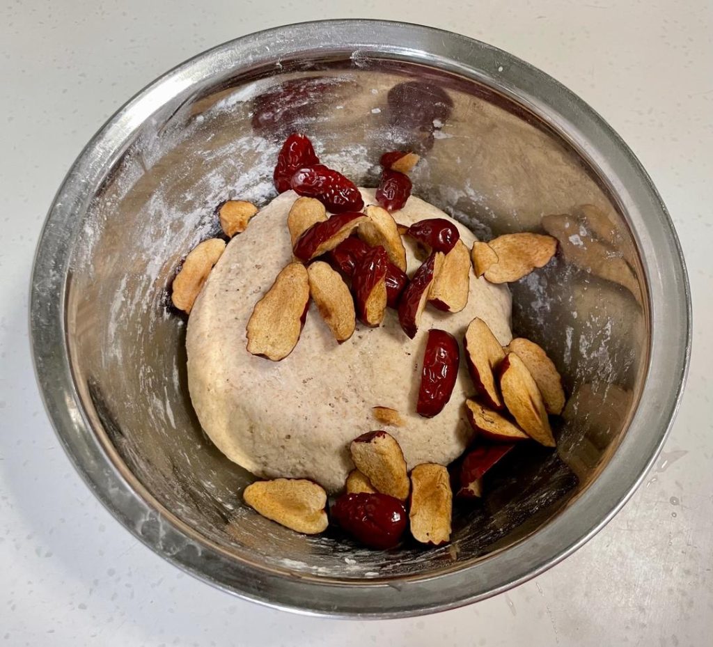 Degas & Add Mix-ins: Punch the dough down. Add the chopped red dates (and walnuts/raisins if using). Knead them into the dough thoroughly to push out excess air bubbles.