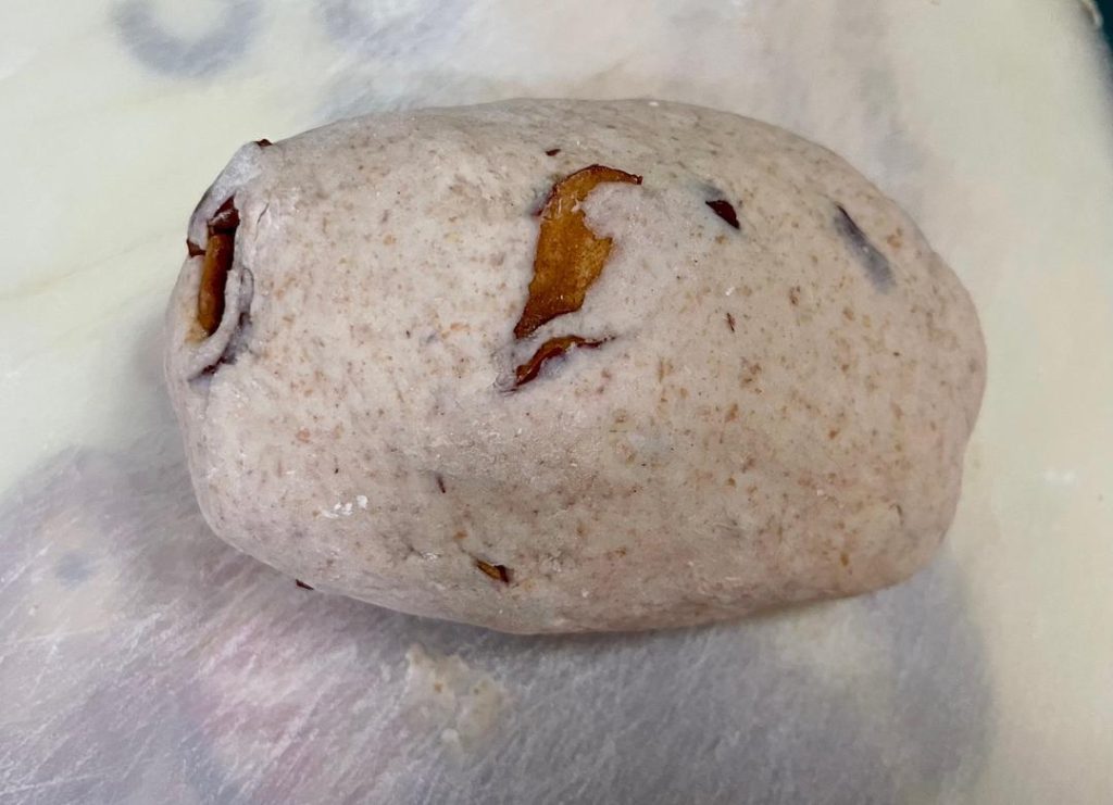 Degas & Add Mix-ins: Punch the dough down. Add the chopped red dates (and walnuts/raisins if using). Knead them into the dough thoroughly to push out excess air bubbles.