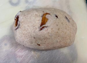Degas & Add Mix-ins: Punch the dough down. Add the chopped red dates (and walnuts/raisins if using). Knead them into the dough thoroughly to push out excess air bubbles.
