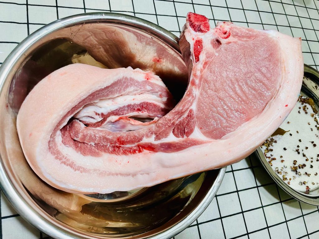 Cut your 5.5 lbs of pork belly into long strips (about 1.5 to 2 inches wide) to ensure even curing and drying. Do not remove the skin.