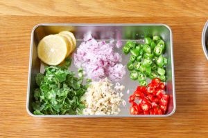 Chop Aromatics AND Slice Chilies AND Slice Lemon